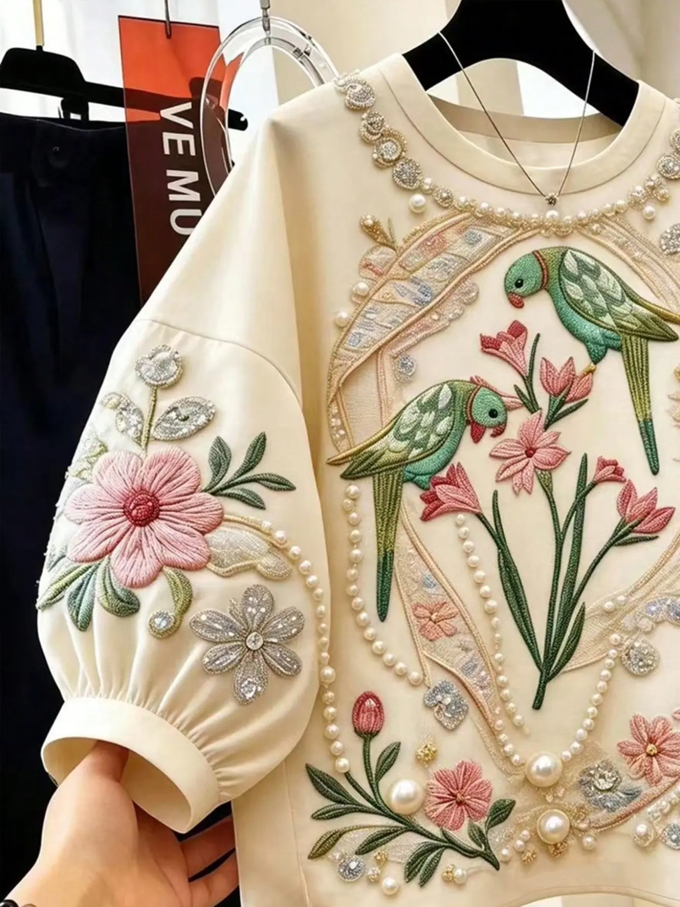 Cream petal-sleeve top with bird and floral embroidery