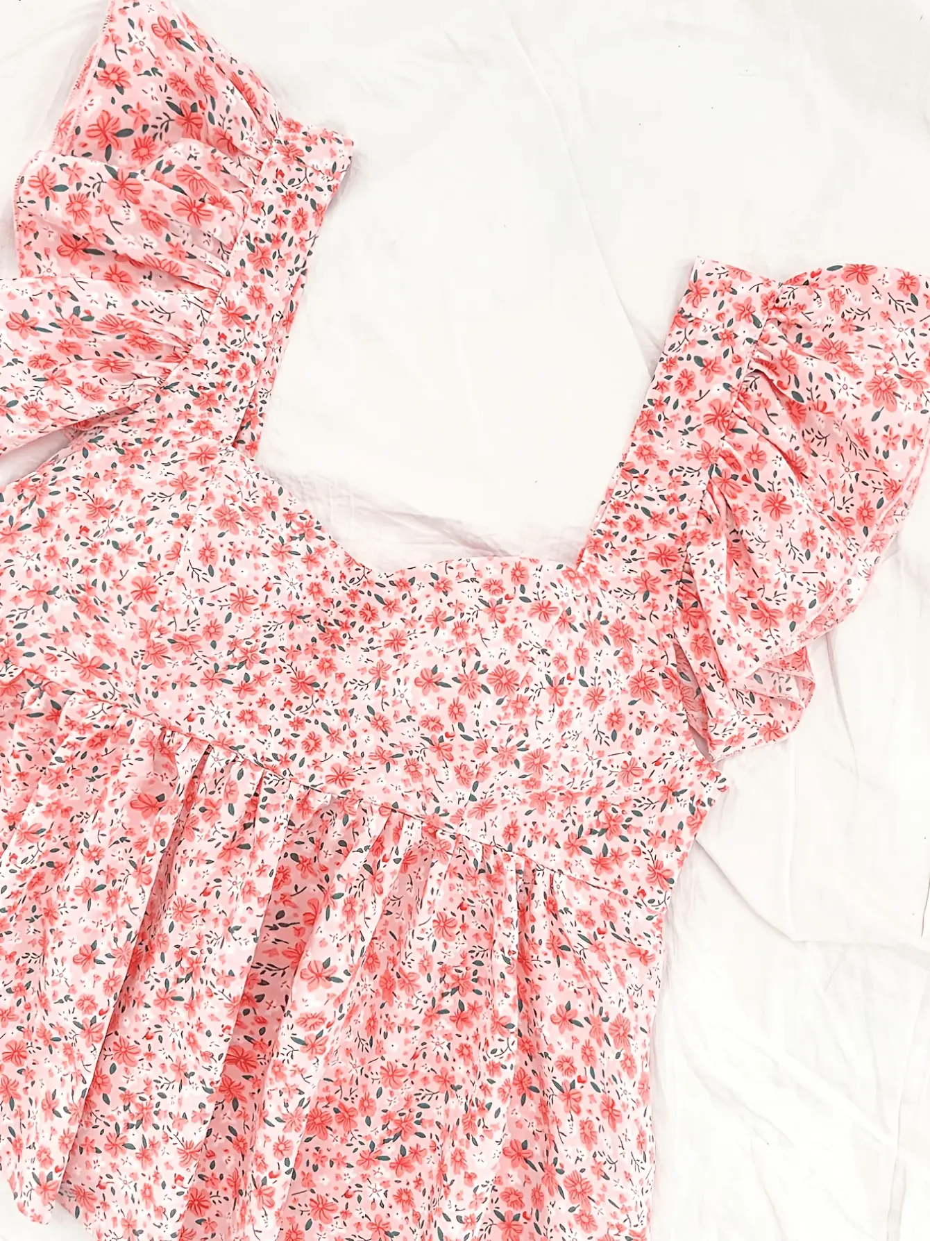 Women’s pink ditsy floral ruffle-trim peplum top detail