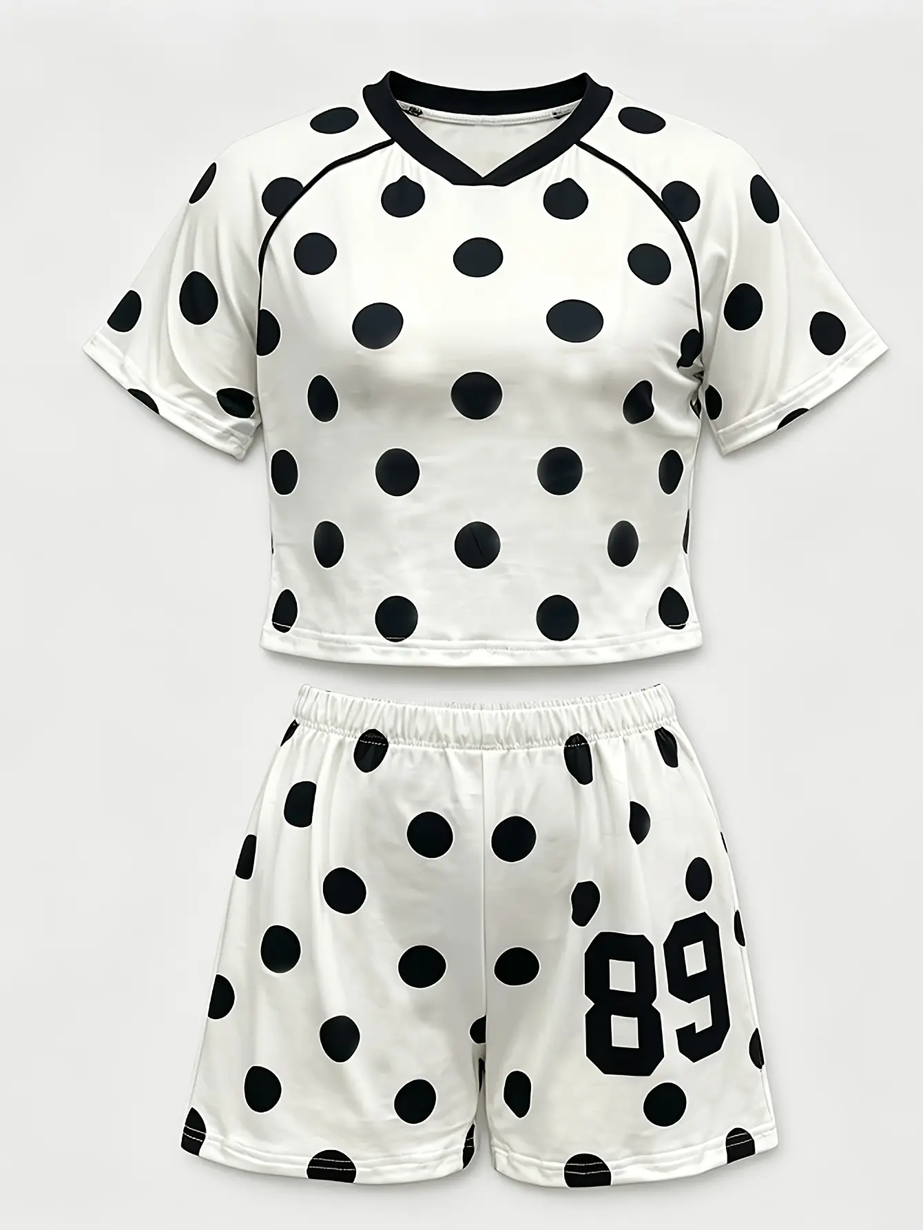 Women’s white polka-dot T-shirt and shorts set flat lay
