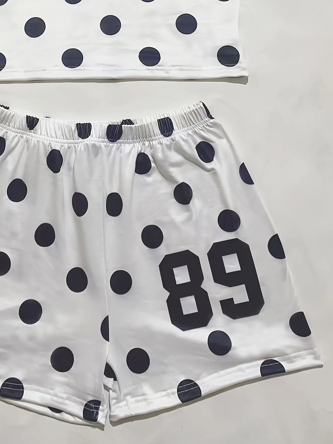 Women’s white polka-dot shorts detail